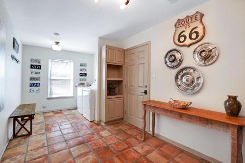 a kitchen with a table and plates on the wall at Richters Garage - A Birdy Vacation Rental in Boerne