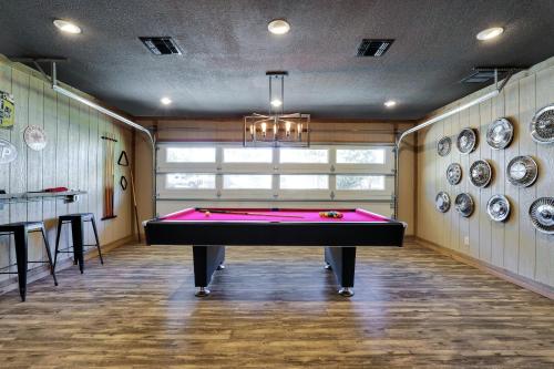 a pool table in a room with plates on the wall at Richters Garage - A Birdy Vacation Rental in Boerne