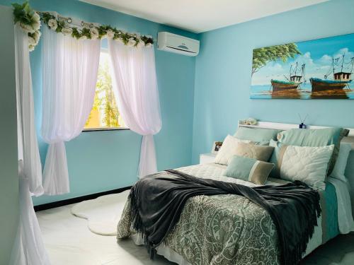 A bed or beds in a room at Villa Paradise in Brazil - Praia de Guaratiba Prado-BA