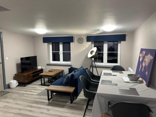 a living room with a couch and a table at NEW HAVEN APARTMENTS IN THE CENTRE. in Boston