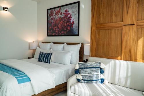 Postel nebo postele na pokoji v ubytování Flamboyan Hotel & Residences