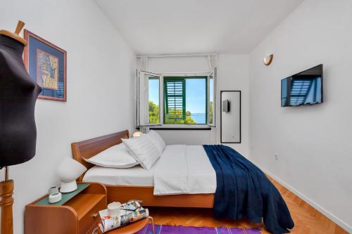 Giường trong phòng chung tại Apartments RATAC