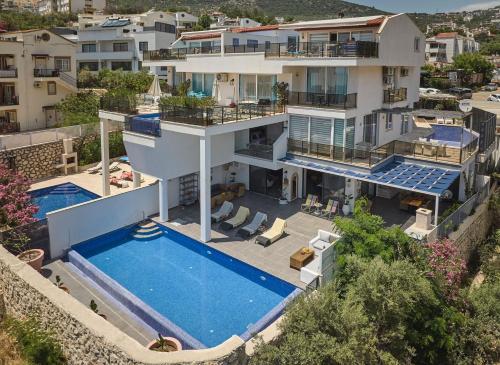 an aerial view of a house with a swimming pool at Villa Rio in Kalkan
