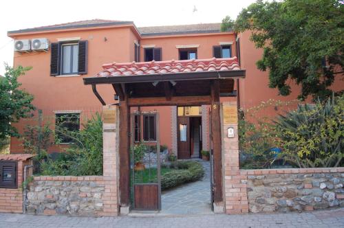 an entrance to a house with a brick building at Lamato Borgo in SantʼEufemia Lamezia
