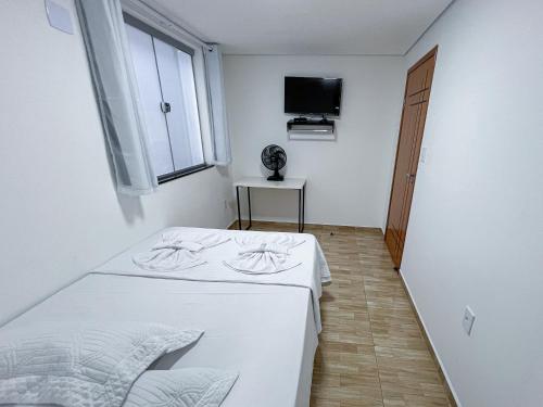 En eller flere senge i et værelse på Lebrinhos hotel