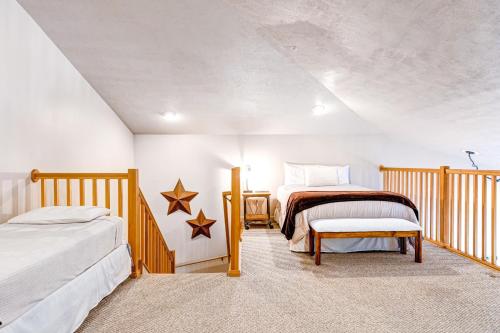 a bedroom with two beds and a table at The Restful Retreat in Park City