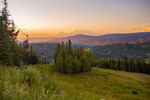 a gazebo on a hill with a view of the mountains at Woodbridge Unit 29E in Snowmass Village