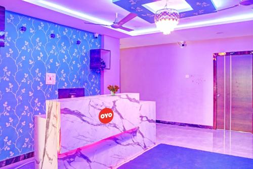 Ένα ή περισσότερα κρεβάτια σε δωμάτιο στο Super Hotel O SAI LEELA RESIDENCY