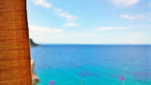 a view of the ocean from a window at Beleri House in Himare