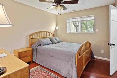 a bedroom with a bed and a ceiling fan at Overland Park ( I 35, Hwy. 69, and 87 th St. ) in Overland Park