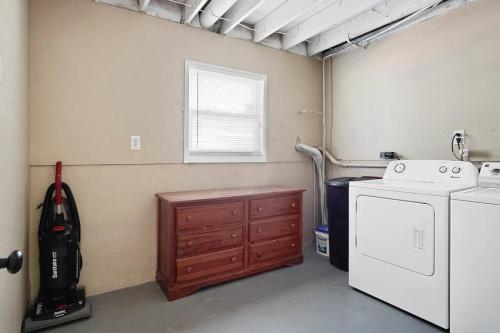 a laundry room with a washer and dryer in it at Overland Park ( I 35, Hwy. 69, and 87 th St. ) in Overland Park