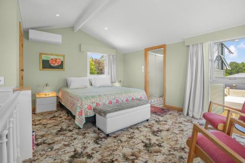 a bedroom with a bed and a window at Farley Avenue Turret & Lounge in Greytown
