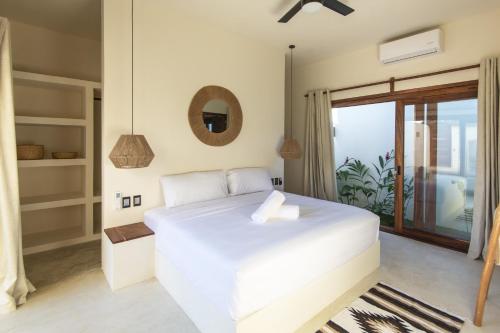 Giường trong phòng chung tại La petite Casa - Luxury home close to La Punta