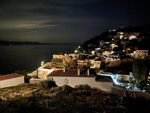 a town on a hill at night at Louisa’s View in Hydra