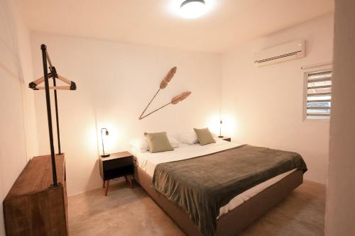 a bedroom with a large bed in a room at Landhuis Daniel - Plantation House in Tera Kora