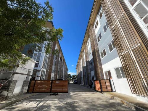 an alley between two buildings with a blue sky at CJ’sstaycation in Lapu Lapu in Maribago