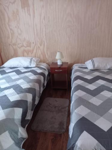 Postel nebo postele na pokoji v ubytování los ulmos 2