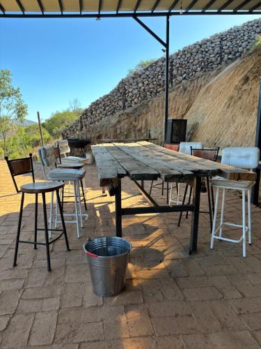 a wooden picnic table and chairs and a bucket at Residencia Artistica CasaVino in Casablanca