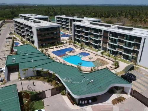 - une vue aérienne sur un bâtiment du complexe doté d'une piscine dans l'établissement Mana Beach Pono by Flats Prime, à Porto de Galinhas