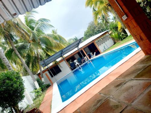 an aerial view of a house with a swimming pool at Rancho santa cecilia in Sonsonate