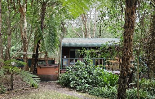 a house in the middle of a forest at Wanderers Retreat in Nelson Bay