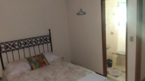 Postel nebo postele na pokoji v ubytování Hospedaria Meu Lar
