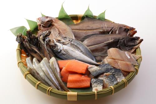 a basket filled with different types of fish and vegetables at Hotel Angel Grandia Echigo Nakazato in Yuzawa