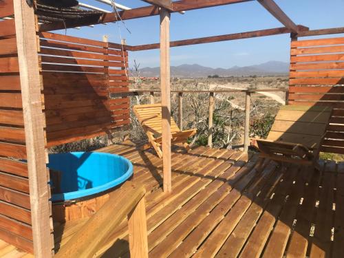 a deck with a view of the desert at Eco Lodge Lorotuerto de Guanaqueros in Coquimbo