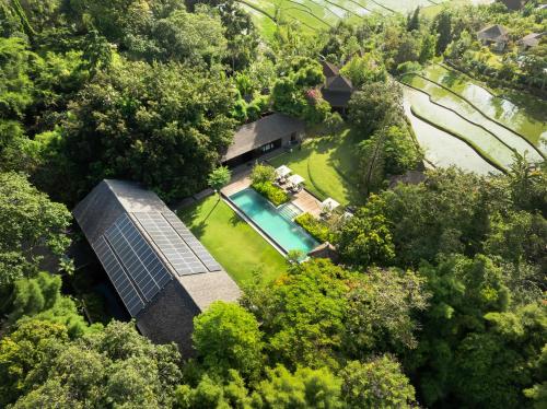 an overhead view of a house with a solar roof at Villa Amita by Nakula in Kerobokan