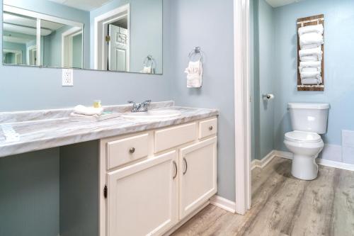 a bathroom with a sink and a toilet at Condo in Gatlinburg very peaceful - 10 min Walk to Main Strip in Gatlinburg