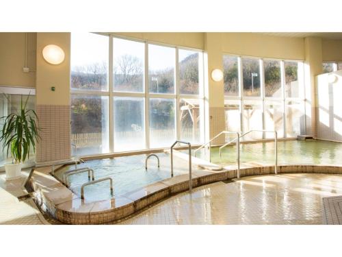 a large pool of water in a room with windows at Hotel Keipu - Vacation STAY 11139v in Hakodate