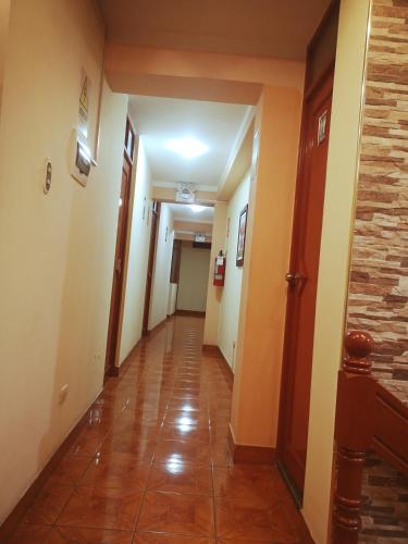 a hallway of a building with a hallway at Hotel lucero real in Tacna