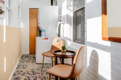 a small room with two chairs and a table at Comfort & Cozy 2BR Family Stay at Downtown Washington DC in Washington, D.C.