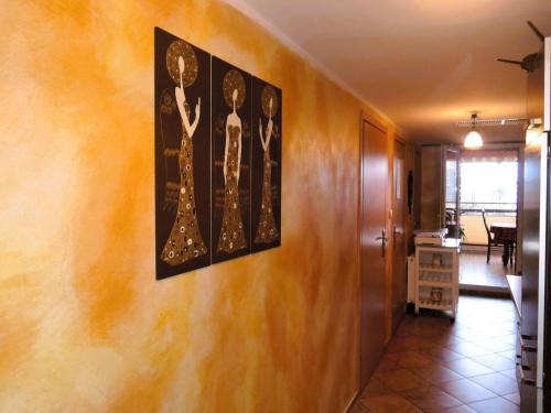 a hallway with two paintings on the wall at Holiday Home Ko czewo near Lakes and Forests in Kołczewo