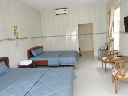 Кровать или кровати в номере Biển Ngọc Homstay
