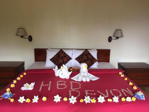 Postel nebo postele na pokoji v ubytování Bali Rahayu Homestay