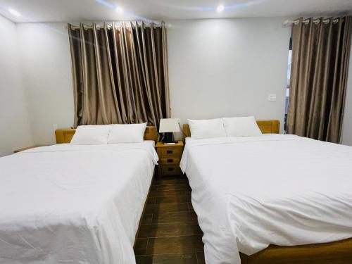เตียงในห้องที่ Benzen Villas Nha Trang