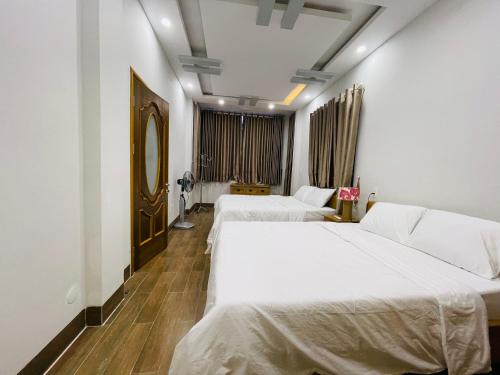 เตียงในห้องที่ Benzen Villas Nha Trang