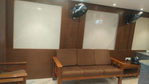 a living room with a couch in a room at A.R Residency in Chennai