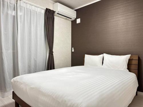 Кровать или кровати в номере 71 Mt view - A棟 -