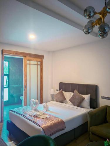 a bedroom with a large bed with avisor at The Willow Phangan in Koh Phangan