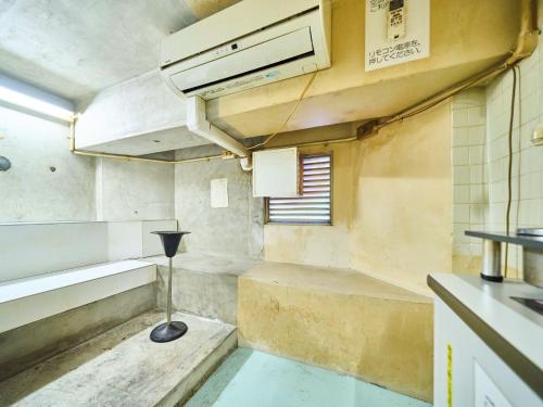a small kitchen with a sink and a stove at Okasan Hotel - Vacation STAY 77664v in Ogaki