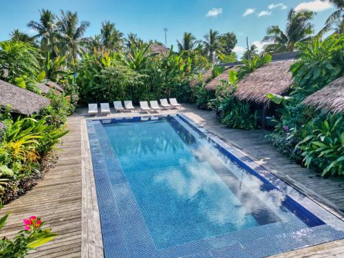 a swimming pool at a villa with a resort at Kajali Siargao in General Luna