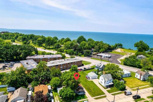 an aerial view of a building with a parking lot and the ocean at HOUSE WITH FREE PARKING in Lorain