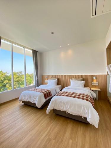 Cama o camas de una habitación en Punn Hotel Korat