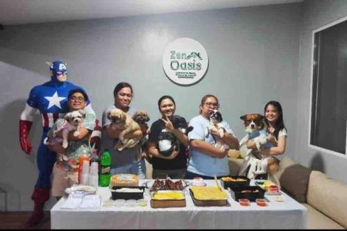 a group of people standing in front of a table at Welcome to Our Farm House in Del Rosario