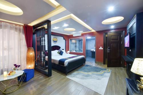 a bedroom with a bed and a television in it at Sapa Nature View Hotel in Sa Pa