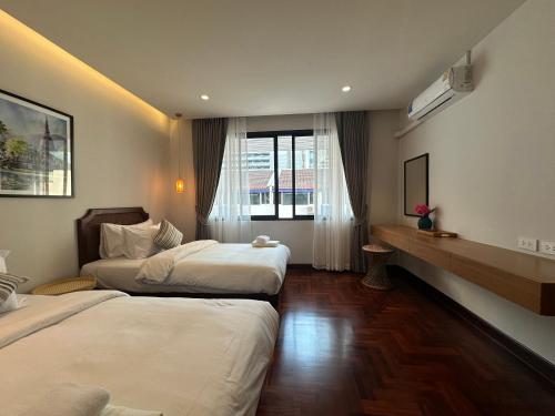 Katil atau katil-katil dalam bilik di Bunya House near BTS Asok, Terminal21 Free BF