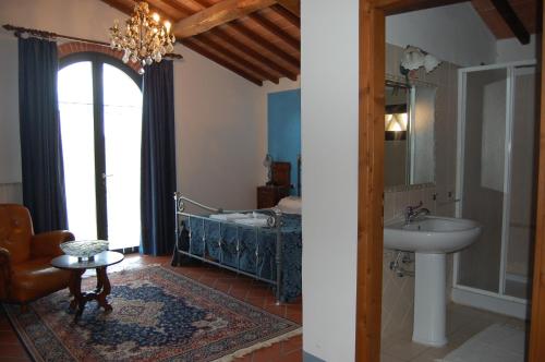 a bathroom with a sink and a bathroom with a tub at Fattoria Antognoni in Reggello