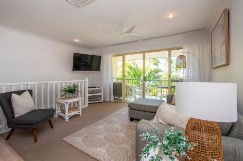 a living room with a couch and a chair at Unit 10 Sails on Horseshoe in Horseshoe Bay